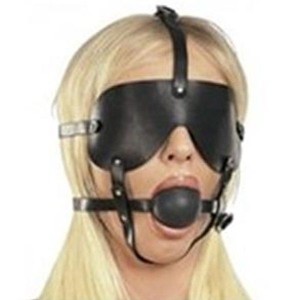 Black Muzzle With A Mask And A Gag On The Straps